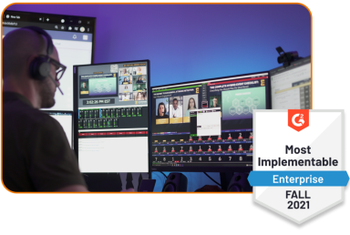 Professional managing multi-screen video production and streaming studio setup, paired with G2 badge for Most Implementable (Enterprise) Fall 2021 Professional managing multi-screen video production and streaming studio setup, paired with G2 badge for Most Implementable (Enterprise) Fall 2021