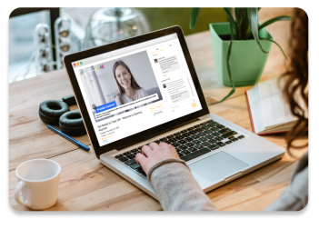 Person attending virtual event on laptop computer, watching live video while using chat feature Person attending virtual event on laptop computer, watching live video while using chat feature